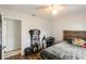 Simple bedroom with hardwood floors, a small desk, and minimalist decor at 2070 Keyes Ln, Deltona, FL 32738