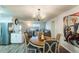 Charming dining area with open concept living and stainless steel refrigerator at 2070 Keyes Ln, Deltona, FL 32738