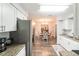 Kitchen view of elegant dining area that features a chandelier and stylish chairs at 2070 Keyes Ln, Deltona, FL 32738
