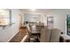 Bright dining area with wood floors, stylish furniture and views to the living room at 2070 Keyes Ln, Deltona, FL 32738