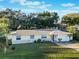 Charming single-story home with a well-manicured lawn and mature trees in a desirable neighborhood at 2070 Keyes Ln, Deltona, FL 32738