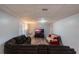 Bright living room featuring vinyl floors, and comfortable couches with a TV at 2070 Keyes Ln, Deltona, FL 32738