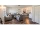 Bright living room featuring modern decor, wood floors, and an open concept layout at 2070 Keyes Ln, Deltona, FL 32738