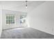 Bright bedroom with two sun-filled windows overlooking the yard at 2081 The Oaks Blvd, Kissimmee, FL 34746