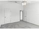 Spacious bedroom featuring neutral carpeting, an open doorway, and a closet at 2081 The Oaks Blvd, Kissimmee, FL 34746