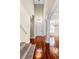 Grand foyer with hardwood floors, a staircase, chandelier, and elegant architectural columns at 2081 The Oaks Blvd, Kissimmee, FL 34746