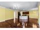 Open-concept kitchen with hardwood floors, central island, and stylish cabinetry at 2081 The Oaks Blvd, Kissimmee, FL 34746