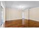 Spacious living room featuring hardwood floors, elegant lighting, and neutral walls at 2081 The Oaks Blvd, Kissimmee, FL 34746