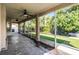Screened lanai with ceiling fans overlooks the lush backyard, offering a tranquil outdoor space at 2081 The Oaks Blvd, Kissimmee, FL 34746