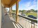 A covered balcony with a view of the community and street at 2124 Betsy Ross Ln, St Cloud, FL 34769