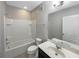 Standard bathroom featuring a shower-tub combo and a vanity sink with a large mirror at 2124 Betsy Ross Ln, St Cloud, FL 34769
