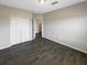 Spacious bedroom with a neutral palette and ample closet space with tile floors at 2124 Betsy Ross Ln, St Cloud, FL 34769