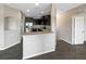 Modern kitchen featuring dark cabinets, stainless steel appliances, and granite countertops at 2124 Betsy Ross Ln, St Cloud, FL 34769