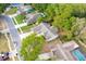Aerial view of the neighborhood with mature trees, showcasing the home's location and surrounding amenities at 2132 Majestic Woods Blvd, Apopka, FL 32712
