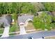 Aerial view of the home showcasing its layout and surrounding lush landscaping at 2132 Majestic Woods Blvd, Apopka, FL 32712