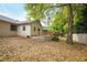 Lush backyard featuring a wooden deck with mature trees providing shade at 2132 Majestic Woods Blvd, Apopka, FL 32712