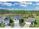 Aerial view of the home and neighborhood with beautiful landscaping at 216 Miles Ct, Davenport, FL 33837