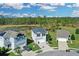 Aerial view of the home and neighborhood with beautiful landscaping at 216 Miles Ct, Davenport, FL 33837