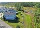 Aerial view of the home with views of a pond and wooded area at 216 Miles Ct, Davenport, FL 33837