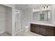 Bathroom with double sinks, glass shower, and walk-in closet at 216 Miles Ct, Davenport, FL 33837