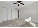 Bedroom with a closet, neutral colors, and ceiling fan at 216 Miles Ct, Davenport, FL 33837