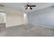 Bedroom features a ceiling fan, blue accent wall, and access to other rooms at 216 Miles Ct, Davenport, FL 33837