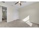Bedroom with carpet flooring, large closet, and ceiling fan at 216 Miles Ct, Davenport, FL 33837