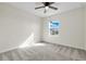 Bright bedroom featuring a ceiling fan, carpet flooring, and natural light at 216 Miles Ct, Davenport, FL 33837