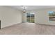 Open dining area with wood-look tile flooring and sliding glass doors leading to the backyard at 216 Miles Ct, Davenport, FL 33837