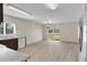 Bright open floor plan features a modern kitchen overlooking a spacious dining area with backyard views at 216 Miles Ct, Davenport, FL 33837