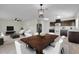 Open-concept living area featuring a kitchen, dining area, living area and stylish wood-look tile flooring at 216 Miles Ct, Davenport, FL 33837