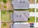 Aerial view showing the house's roof and surrounding landscaping and neighborhood at 2237 Wood Stork Ln, St Cloud, FL 34771