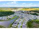 Stunning aerial view showcasing the community layout, including lush greenery, lakes, and residential homes at 2237 Wood Stork Ln, St Cloud, FL 34771