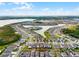 Aerial view of community highlighting the lake and houses within the community at 2237 Wood Stork Ln, St Cloud, FL 34771
