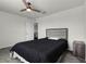 Cozy bedroom featuring a ceiling fan and neutral decor at 2237 Wood Stork Ln, St Cloud, FL 34771