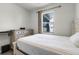 Serene bedroom featuring a bed, dresser, and soft natural light from the window at 2237 Wood Stork Ln, St Cloud, FL 34771