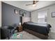 Stylish bedroom with a dark accent wall and modern decor at 2237 Wood Stork Ln, St Cloud, FL 34771