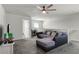 Open living area with a sectional sofa, TV, and a desk near the window at 2237 Wood Stork Ln, St Cloud, FL 34771