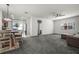Open concept living room with a dining area, ceiling fan, and lots of natural light at 2237 Wood Stork Ln, St Cloud, FL 34771