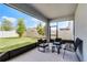 Covered patio with outdoor seating and a view of the backyard at 2237 Wood Stork Ln, St Cloud, FL 34771