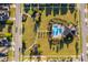 Aerial view of community pool, park and playground, surrounded by lush landscaping and well-maintained grounds at 2289 Aloe Aly, Apopka, FL 32703