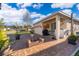 Backyard featuring a brick patio, fire pit, and outdoor seating, perfect for entertaining at 2289 Aloe Aly, Apopka, FL 32703