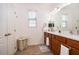 Clean and bright bathroom with double sinks, ample counter space, and a window for natural light at 2289 Aloe Aly, Apopka, FL 32703