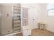 Well-lit bathroom featuring a glass enclosed shower with decorative birds and musical notes and wood-look floors at 2289 Aloe Aly, Apopka, FL 32703