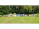 Landscaped common area with a low concrete wall and three wooden planter boxes at 2289 Aloe Aly, Apopka, FL 32703