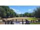 Community dog park featuring an open play area, park benches, and shade trees at 2289 Aloe Aly, Apopka, FL 32703