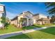 Beautiful single-Gathering home featuring a well-kept lawn, manicured landscaping, and an inviting front entryway at 2289 Aloe Aly, Apopka, FL 32703