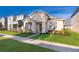 Charming single-story home with a well-manicured lawn, lovely landscaping, and a welcoming front porch at 2289 Aloe Aly, Apopka, FL 32703