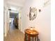 Inviting hallway with wood-look floors and a musical theme with decorative musical notes on display at 2289 Aloe Aly, Apopka, FL 32703