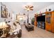 Cozy living room with a ceiling fan, decorative furnishings, and seamless transition to the open-concept kitchen at 2289 Aloe Aly, Apopka, FL 32703